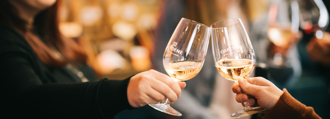Two women toasting with Oakdene wines